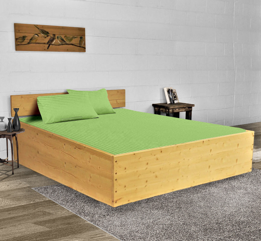 Sage stripe waterbed sheet set on a made waterbed
