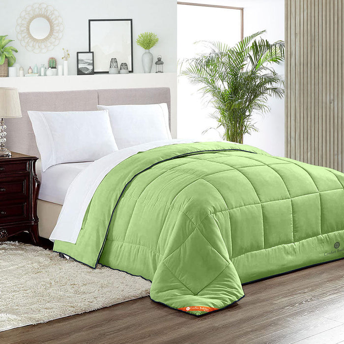 Luxury sage comforter on a made bed