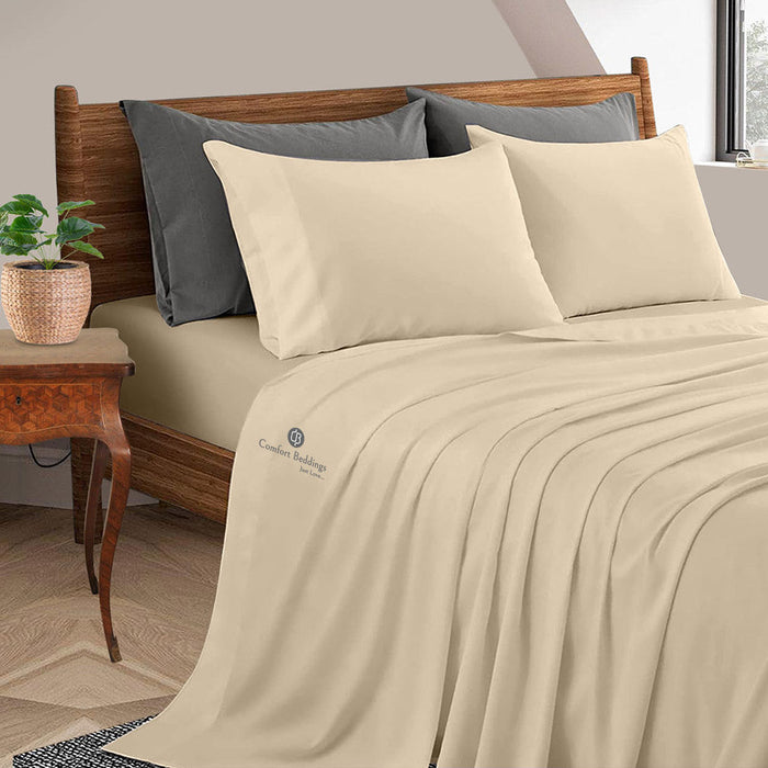 Sand-colored bamboo sheet set on a made bed